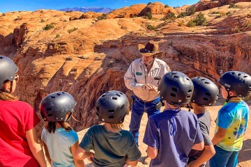 Kids with guide on Hell's Revenge.