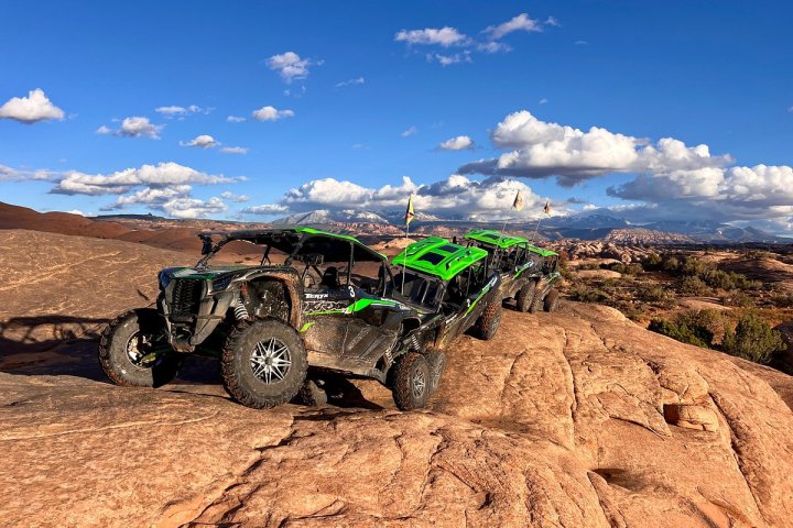 a truck driving down a dirt road